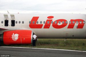An operator checks a Lion Air plane.